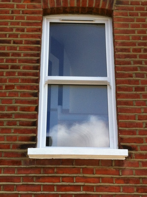 uPVC sash window on Victorian red brick house in Welwyn Garden City